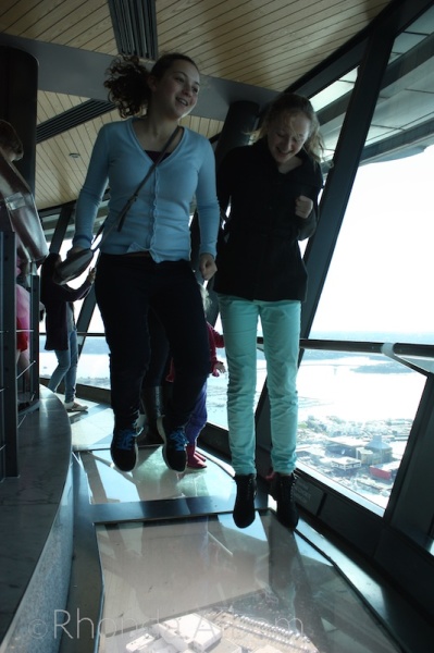 Jumping on the glass floor in the observation deck of the Auckland Sky Tower