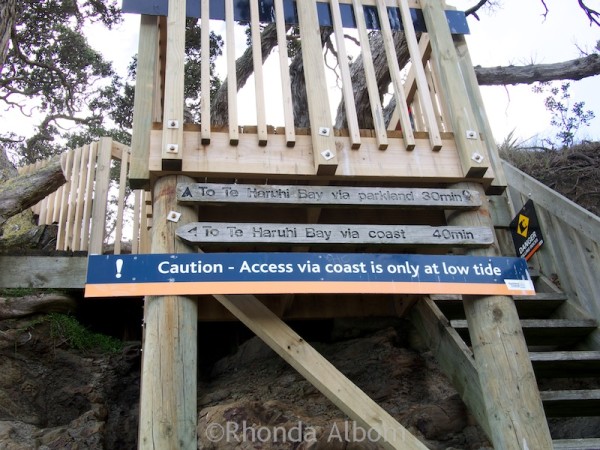Warning sign about hiking from Pink Beach in Shakespear Park Auckland New Zealand