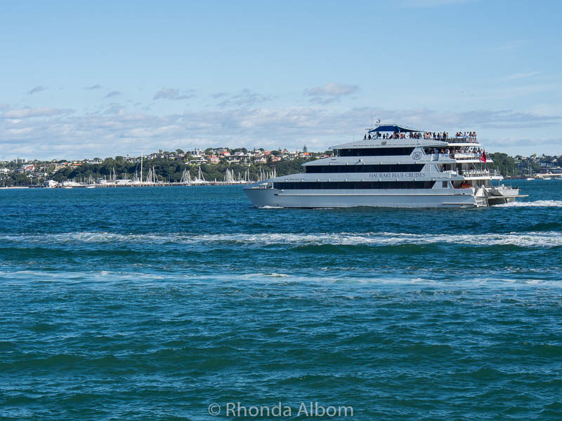 A sunset cruise heading out Devonport Wharf in Auckland New Zealand from