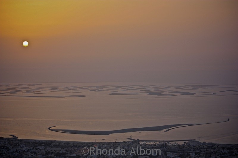 Looking out over the desert at Sunset from the Burj Khalifa the worlds tallest building