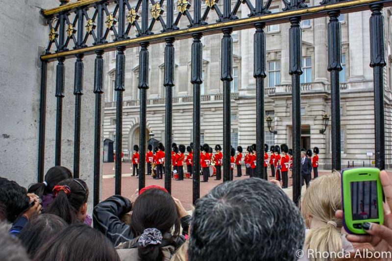 London in One Day: How to See the Highlights of England's Capital City 13 Changing of the guards at Buckingham Palace seen through the fence
