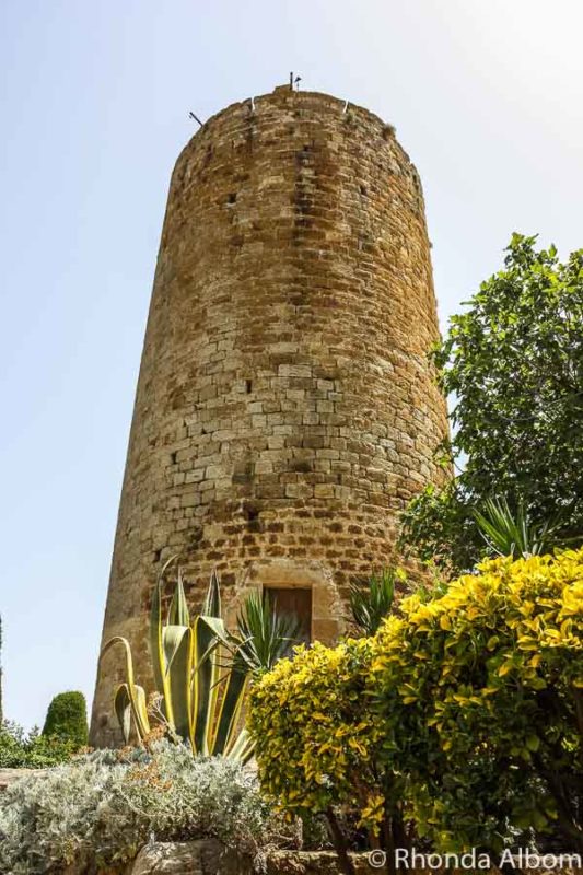 9 Medieval Towns in Catalonia: Barcelona to the Dali Museum 2 The 11th Century Torre de les Hores (Romanesque castle tower) in Pals Spain, one of several medieval towns in Catalonia.