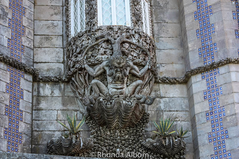 6 Enchanting Castles of Sintra: Explore the Palaces 6 Holding up one of Pena Palace's window is this mythological triton