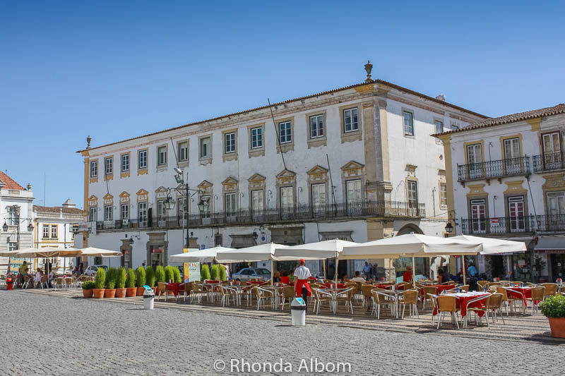 Outdoor restaurants on Giraldo Square in the main square in Evora Portugal