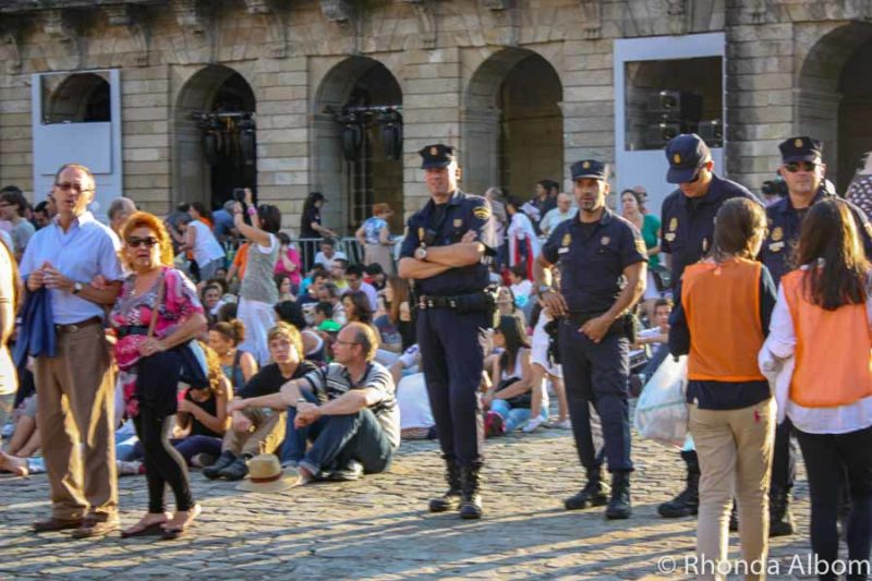 Police and crowds at an event in Spain