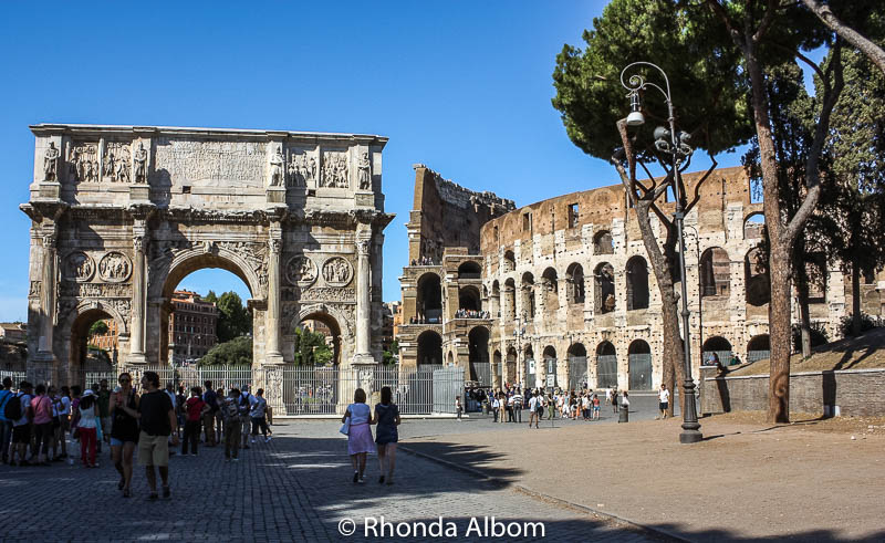 Arch of Constantine stands next to the Colosseum in Rome, Italy