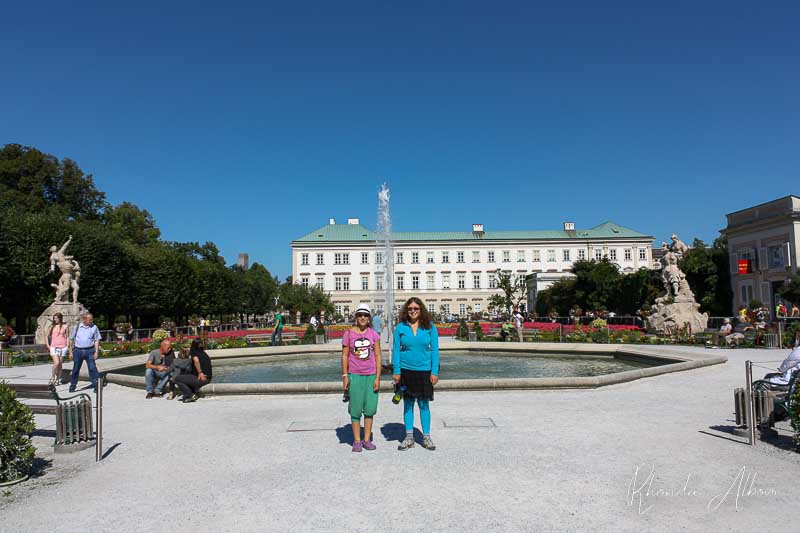 Our girls in front of the fountain at Mirabell Palace  and Gardens