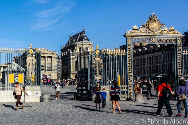 The gold gates greet us on our Paris day trip to Versailles