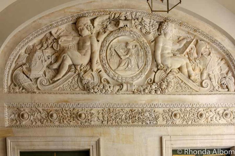 Detailed marble carvings at the Palace of Versailles