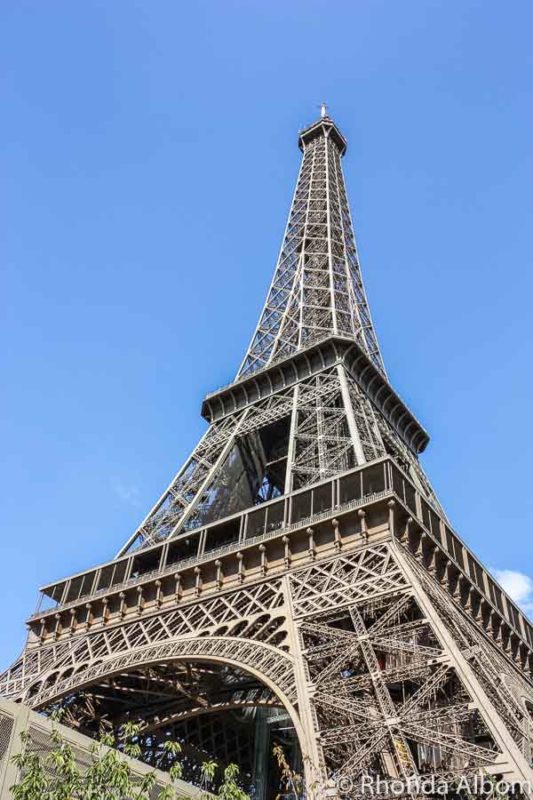 10 Tips to Avoid Crowds in Paris France 9 Standing under the Eiffel Tower and photographing up in Paris France