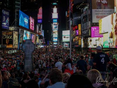 Crowded Times Square at night, one of the New York City highlights