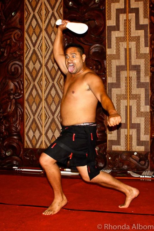 Kiwi Slang: Funny New Zealand Sayings - Visitors Beware! 5 Maori Warrior during a performance at the Waitangi Treaty grounds, a great place to learn a few New Zealand phrases