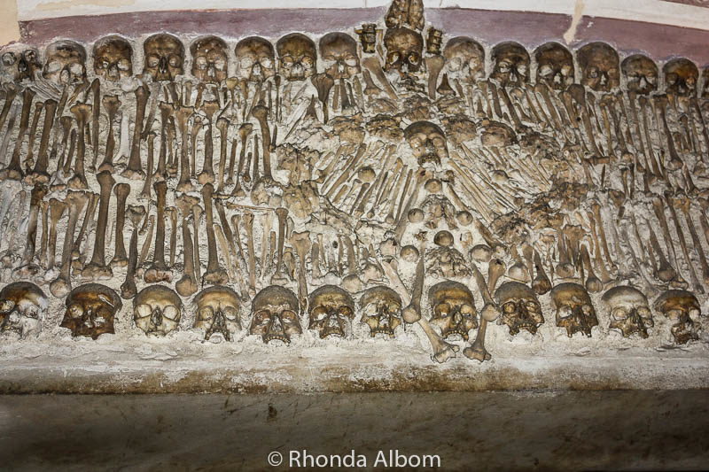 Chapel of Bones Evora and 10 Other World Ossuaries 22 Wall decor at the Chapel of Bones in Evora, Portugal
