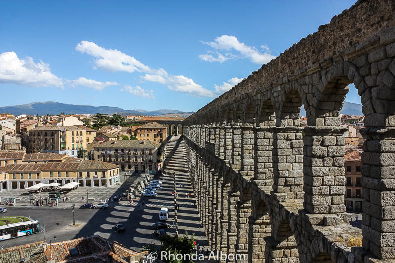 Things to Do in Segovia Spain: Ancient Aqueduct to Fairytale Castle 7 Interesting shadows cast by the two layered archways on this Roman aqueduct.