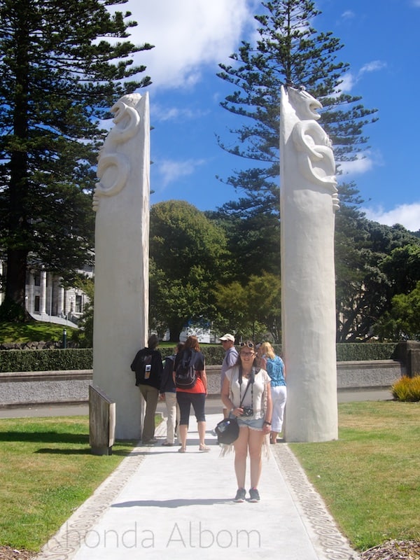 The pole like Maori statues are called Po and represent the upturned Waka (Maori canoe). The tour group is Walk Wellinton.