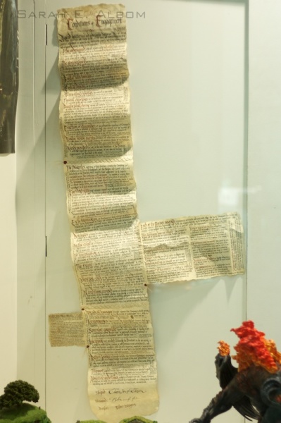 The contract of Bilbo Baggins in the Hobbit at Te Papa museum in Wellington, New Zealand. If you get a close-up look the picture is actually clear enough for it to be readable. For more pictures about the Hobbit movie costume trail check out the original article at Albom Adventures.