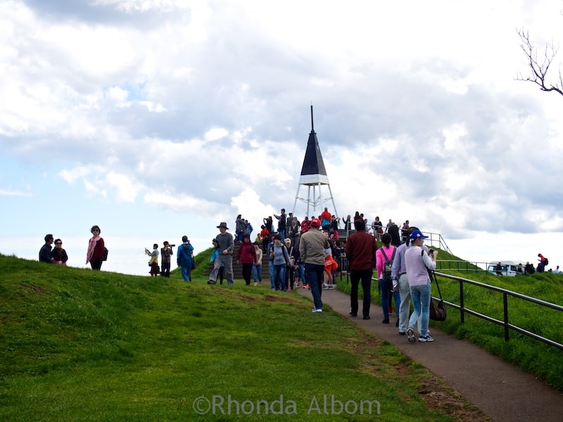 Mount Eden Volcano: Auckland's best hike for city and crater views 7 The marker at the top of the extinct Mount Eden Volcano, Auckland New Zealand