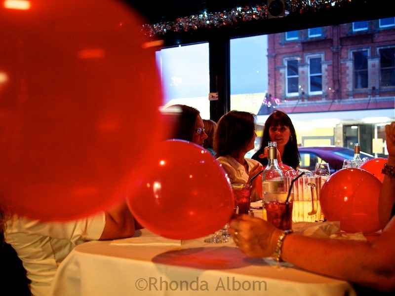 Caluzzi Cabaret Review: My First Time at a Drag Queen Dinner Show 3 Red balloons at an Auckland restaurant in New Zealand