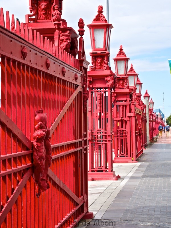 Red fence along the coastline at the Port of Auckland in New Zealand