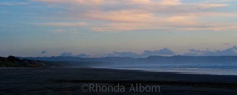 Haze over the distant hills before sunset at Ninety-Mile Beach on the Aupouri Peninsula in New Zealand