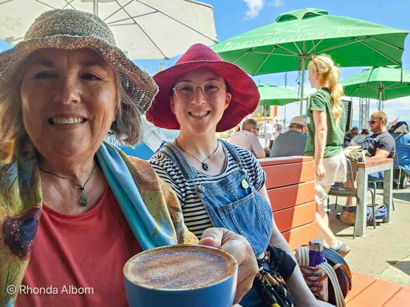 Enjoying coffee at one of the outdoor Wellington restaurants