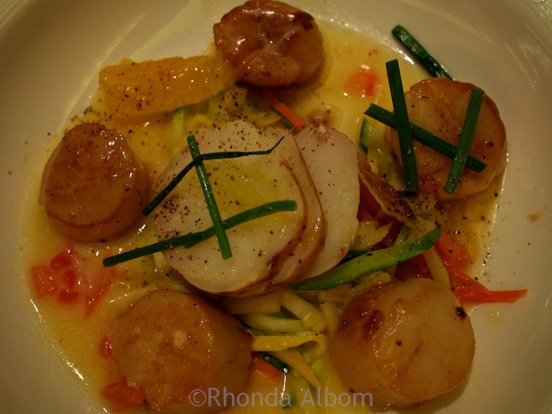 Avoid Cruise Weight Gain: Indulging Onboard without Worry! 5 Scallop dinner served over potatoes with vegetables