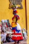 Woman carrying a fruit basket on her head.