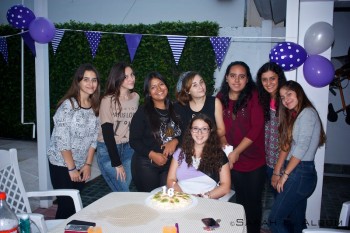 A few of my school friends and a cousin at my 16th birthday party. In Argentina, parties normally occur from about 9:30pm till dawn, but I decided to have an afternoon party as I didn't feel up to hosting an all-night party just yet. The cake in front of me is a pavlova - a traditional New Zealand cake made of eggs.