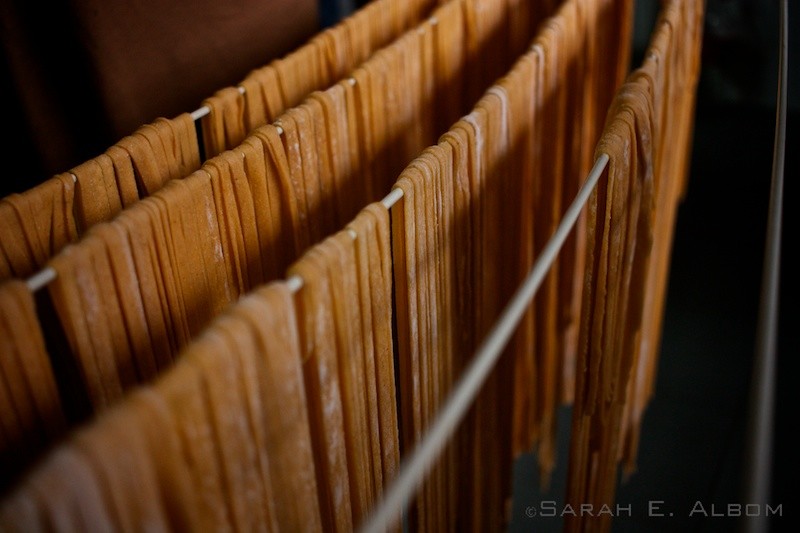 Homemade pasta on a rack, and common Argentinian food originated in Italy. Photo copyright ©Sarah Albom 2016