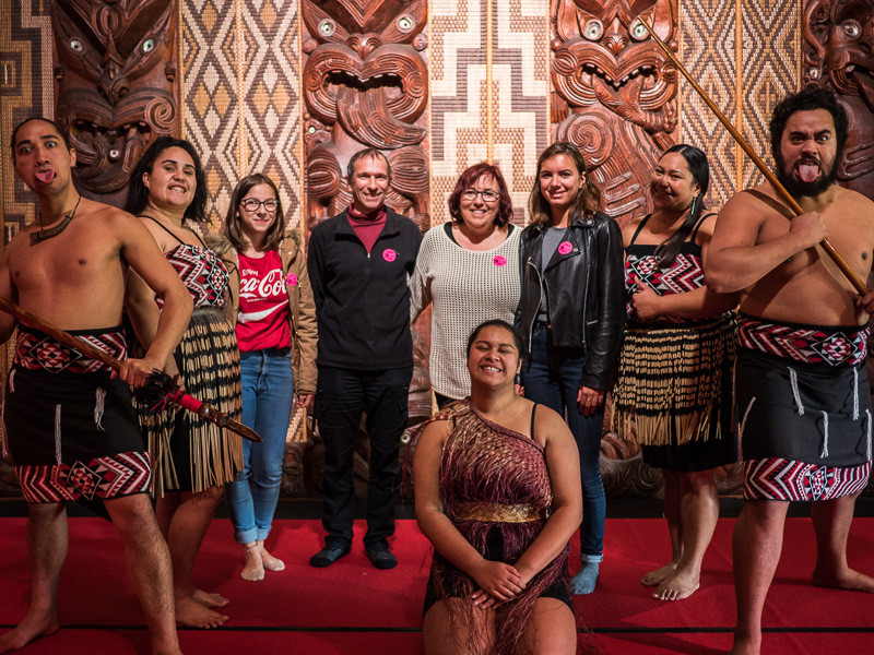 Photo with warriors at the Waitangi Treaty Grounds in New Zealand.