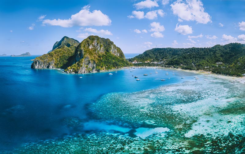 Your Guide to the 5 Best Beaches in Palawan Philippines 5 Aerial panoramic view of Corong Corong lagoon with moored boats. El Nido village, Palawan, Philippines