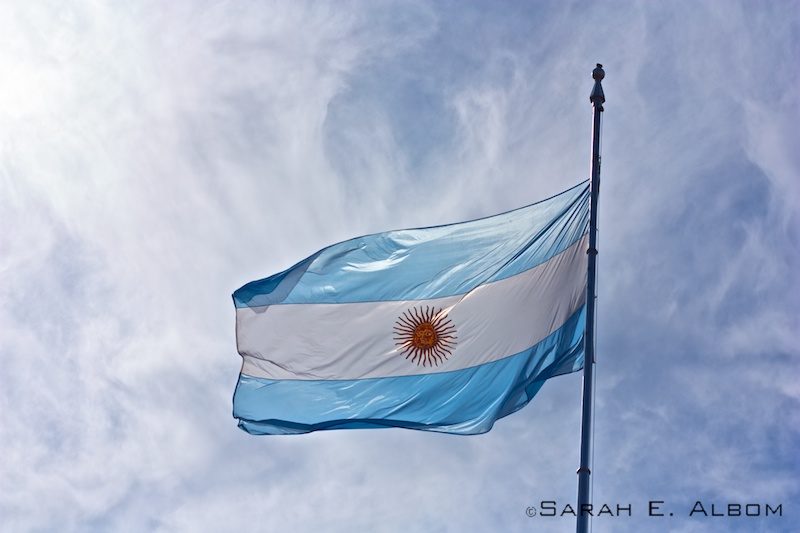 The Argentinian Flag flying over La Casa Rosada in Argentina.Photo copyright ©Sarah Albom 2016