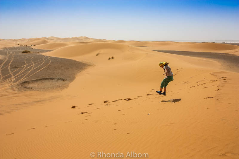 Colors of the Sahara Desert: A Travel Photography Exposé 7 Sarah jumping in the sand dunes.