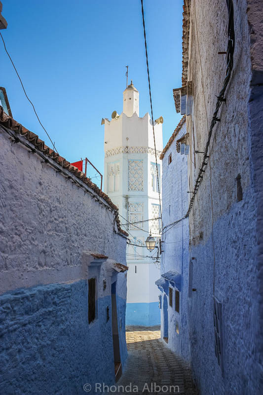 Discovering the Secrets of Chefchaouen Blue City of Morocco 5 Mosque at the end of a narrow street in Chefchaouen in Morocco.