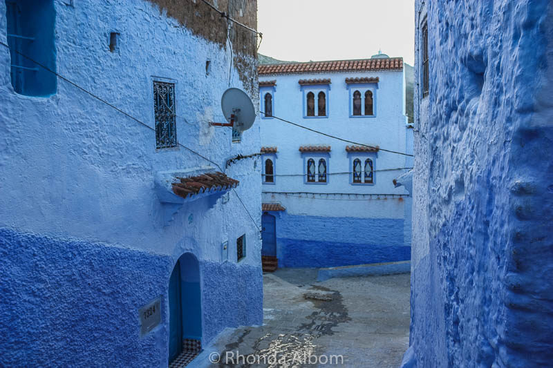 The contrast of new versus old is highlighted by the satellite dish on the side of one of the homes in Chefchaouen in Morocco.