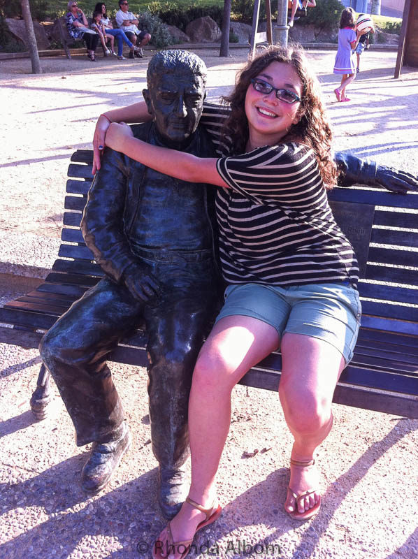 Statue of a man on a bench in Palamos Spain