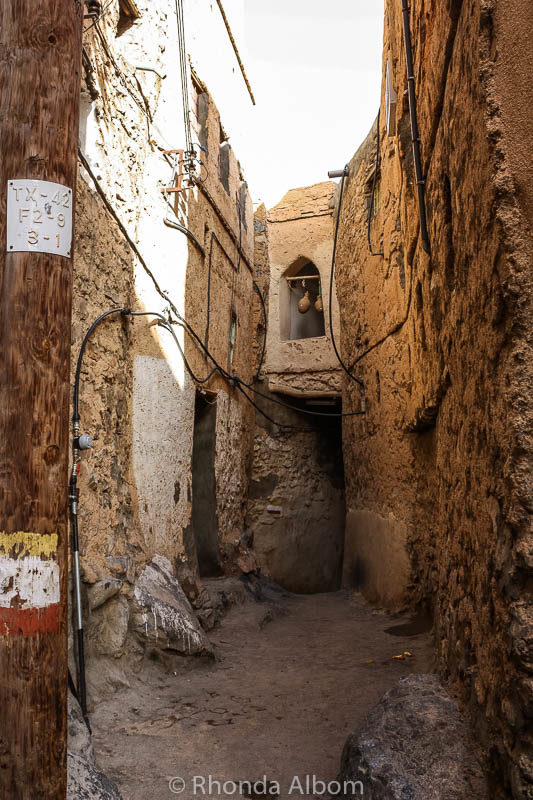 A classic traditional Omani scene, with the water and oil jars hanging in the window.