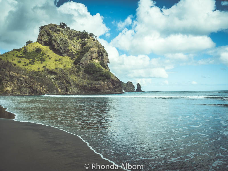 Things to do in West Auckland: Rainforest, Black Sand & Surf Beaches 5 Lion Rock at Piha Beach in Auckland New Zealand