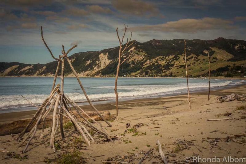 East Cape NZ Driving Itinerary: Gisborne to Opotiki Road Trip 13 Driftwood art on the beach in Tokomaru Bay New Zealand