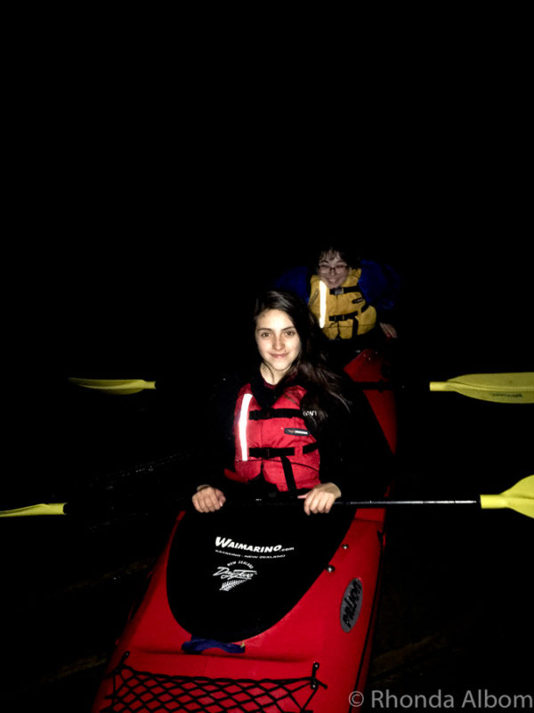 Two girls in a kayak on a dark Night tour - kayak Tauranga