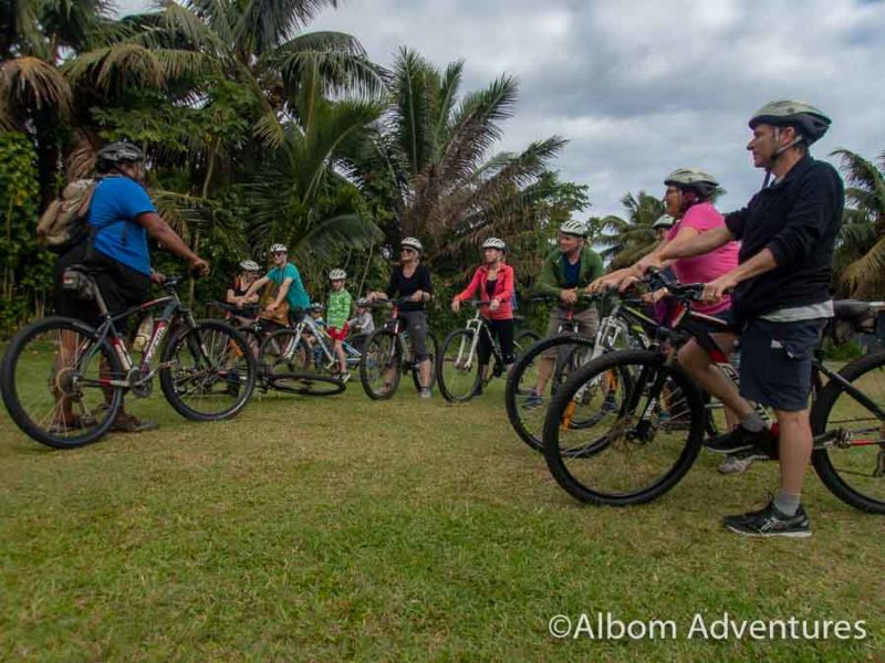 26 Things to Do in Rarotonga: White Sand Beaches, Culture, or Adventure 6 Our group on bicycles, wearing helmets and ready to to on a bicycle tour with Storytellers Eco-Cycle in Rarotonga