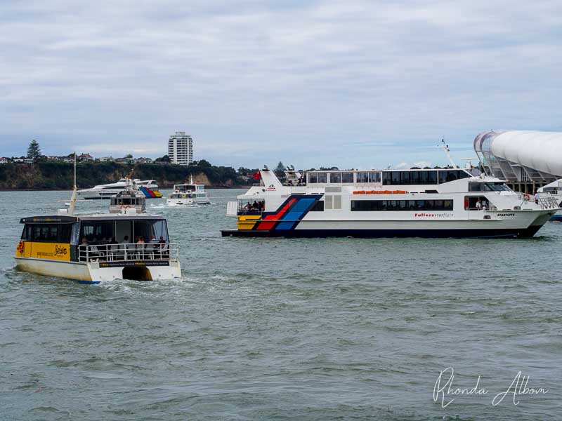 Auckland Sailing: 9 Ways to Get Out on the Water 9 Several ferries either coming in or going out at the Auckland ferry terminal