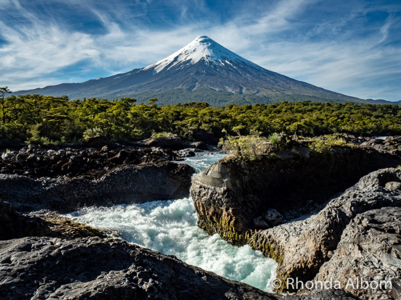 Cruce Andino Review: Andean Crossing from Bariloche to Puerto Varas 19 Osorno Volcano is nature's backdrop for the Petrohue Falls in Chile. Seen while with Cruce Andino