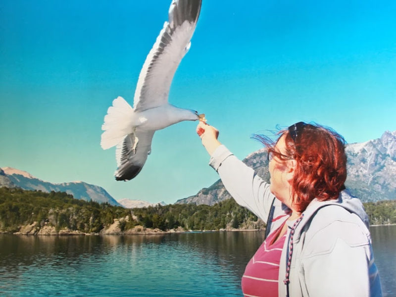 Cruce Andino Review: Andean Crossing from Bariloche to Puerto Varas 3 Rhonda Albom feeding seagull on a Cruce Andino excursion