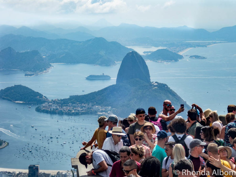 Visit Christ the Redeemer: How to get up Corcovado Mountain, Rio 4 Crowds at Christ the Redeemer monument in Rio de Janeiro Brazil