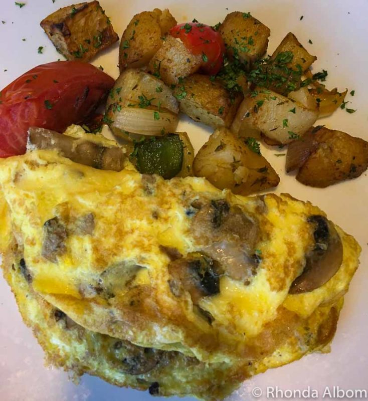 Omelette and potatoes with onion on Azamara Quest where I was unsuccessfully cruising with food allergies