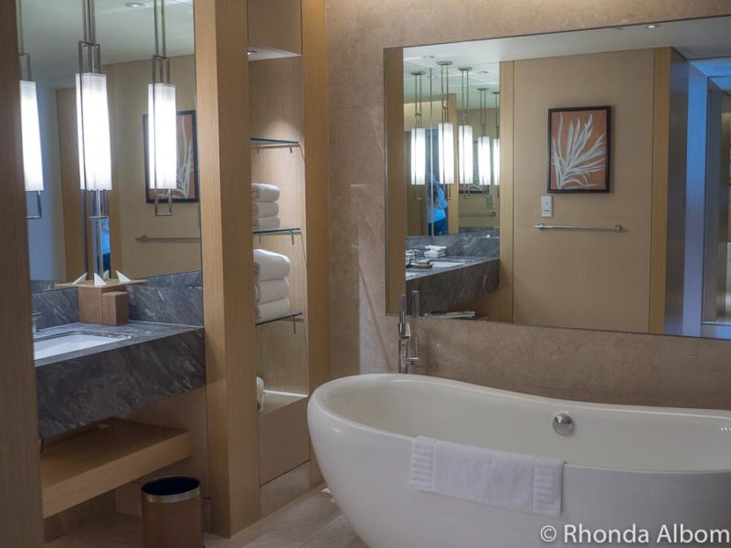 Bathtub, sinks, and accessories in our Marina Bay Sands hotel room
