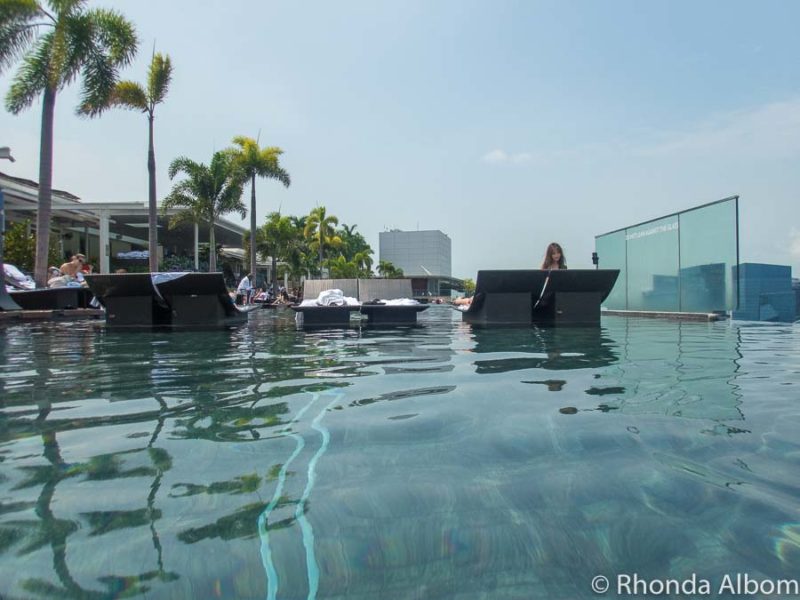Marina Bay Sands Review: Is It Worth the High Price? 14 One guest with a selfie tripod in the Marina Bay Sands hotel pool