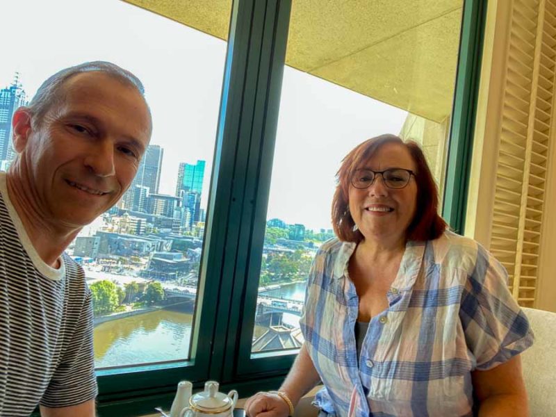 Fun Things to Do in Melbourne for Couples 25 A selfie of Jeff and Rhonda Albom enjoying breakfast with a view of Melbourne from the 24th floor of one of the Langham, one of the best places to stay in Australia