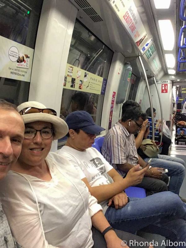 Sitting on the immaculately clean MTR train. More on this Singapore travel guide